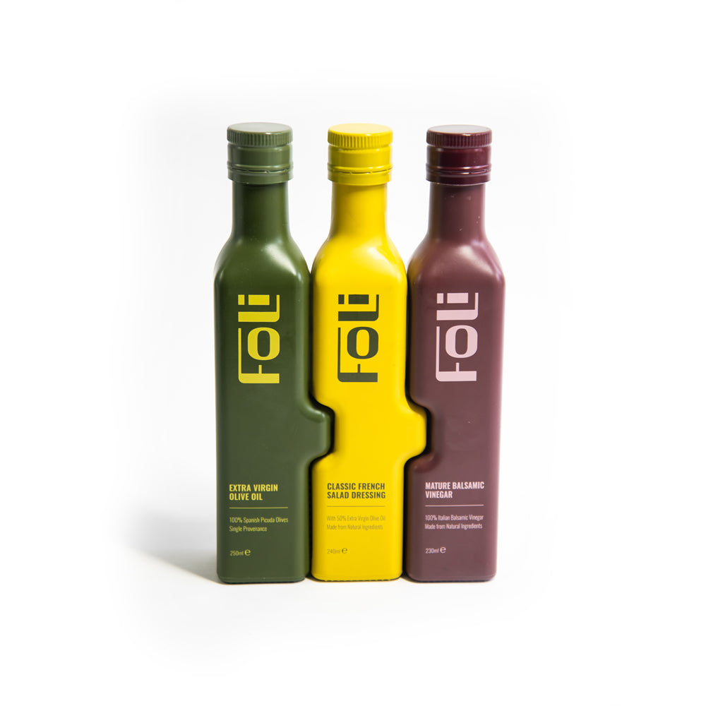 Trio of FOLI bottles containing olive oil salad dressing and balsamic vinegar