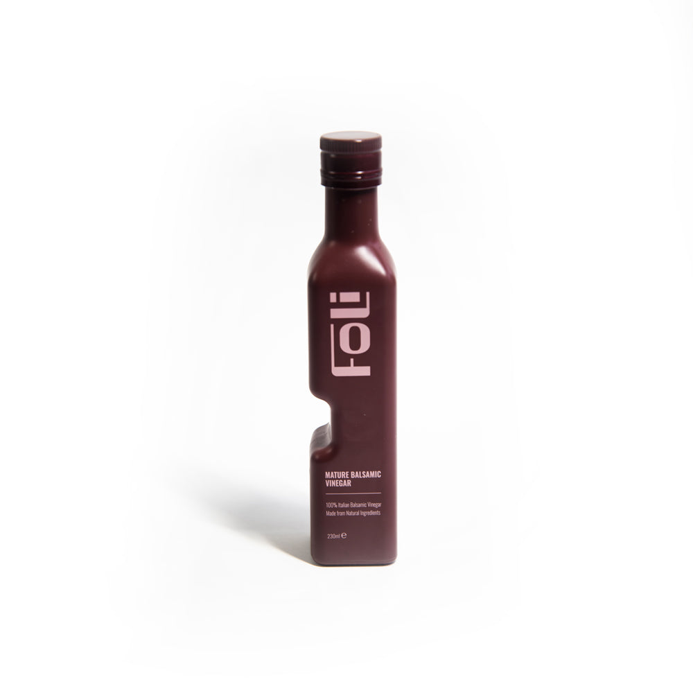 Interlocking bottle of FOLI balsamic vinegar on a white background